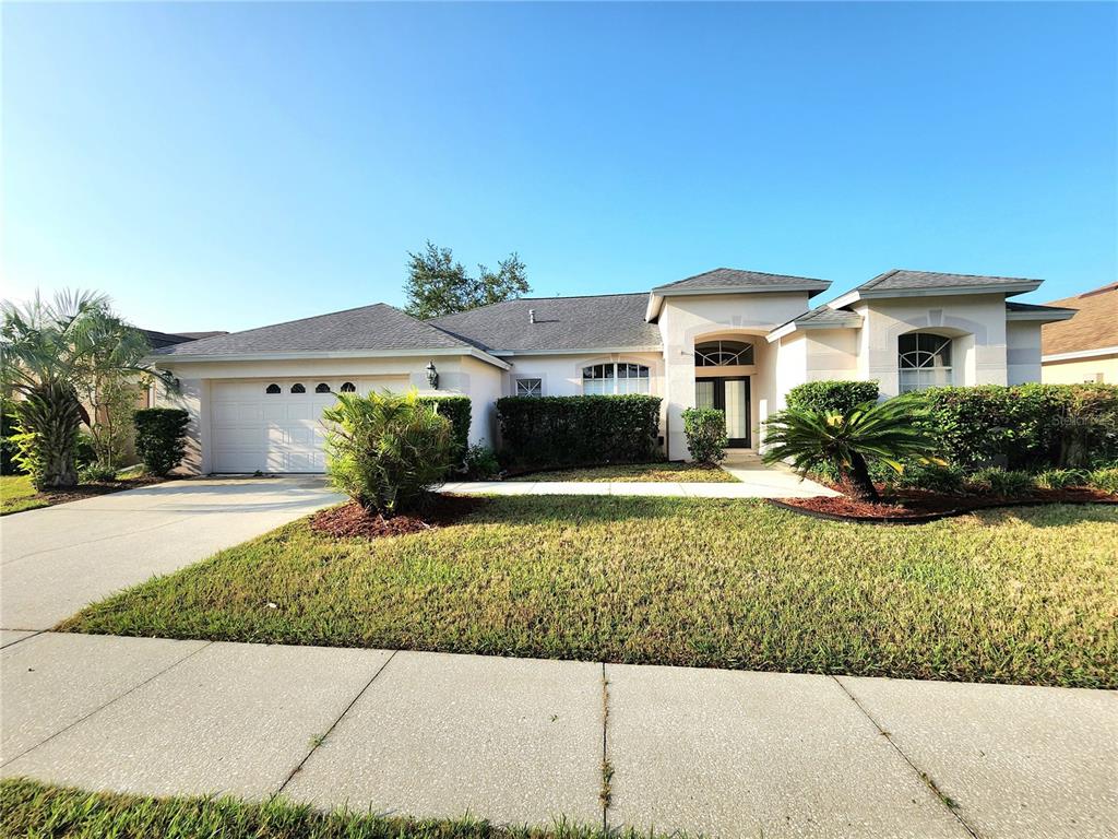 1820 South Ridge Drive Valrico, FL 33594 - Photo 1 of 1 a front view of a house with a yard