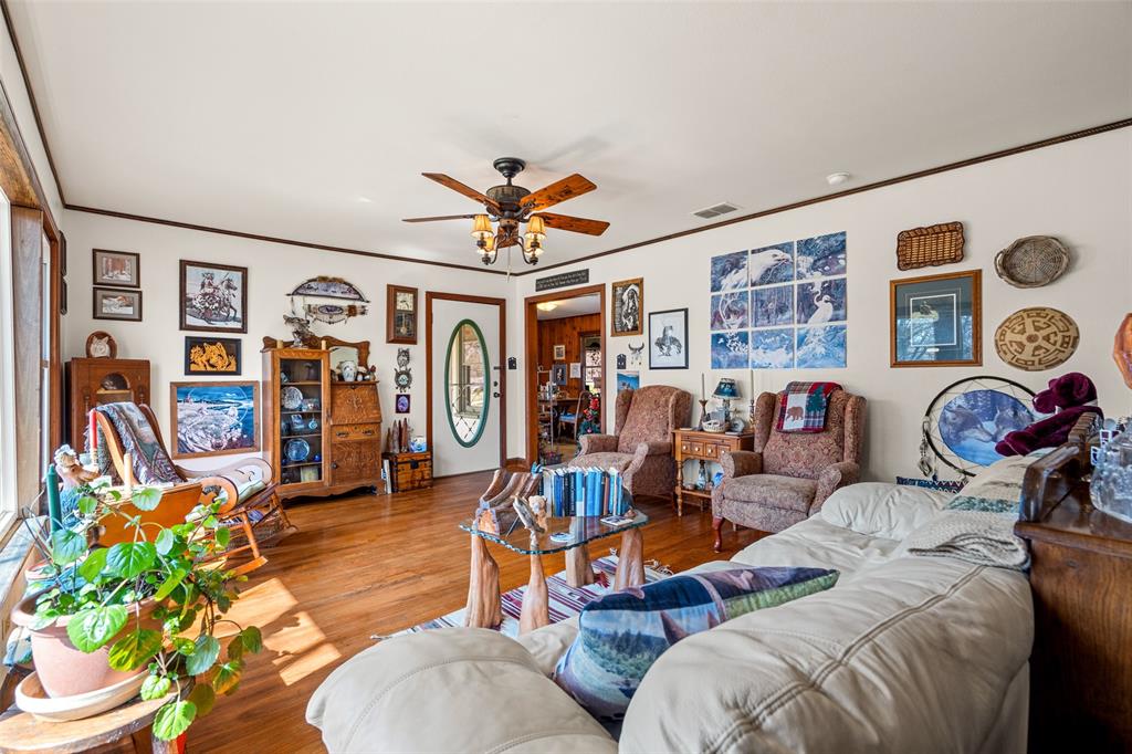 609 East Quitman Street Alba, TX 75410 - Photo 11 of 34 a bedroom with furniture and wooden floor