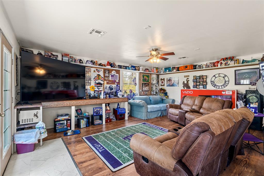 609 East Quitman Street Alba, TX 75410 - Photo 29 of 34 a living room with furniture and a flat screen tv