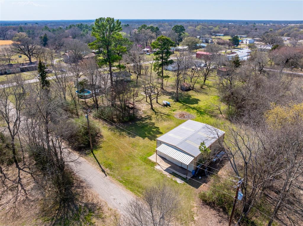 609 East Quitman Street Alba, TX 75410 - Photo 5 of 34 an aerial view of residential houses with outdoor space