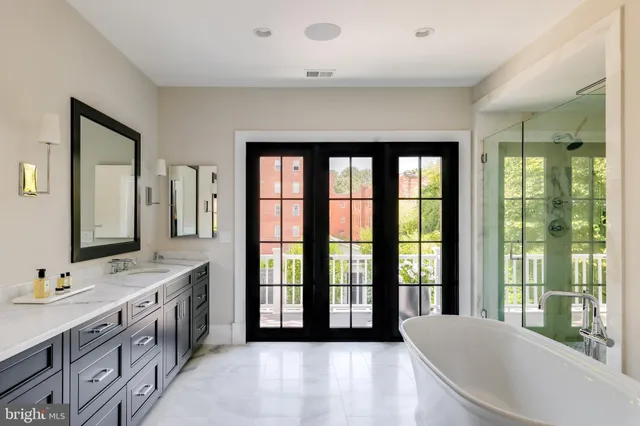 a bathroom with a bathtub and shower