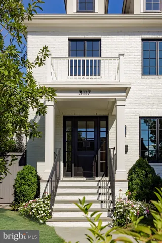 a view of a building with potted plants