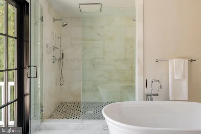 a white bath tub sitting in a bathroom
