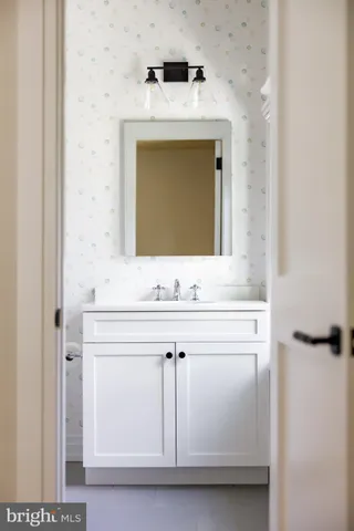 a living room with furniture rug and wooden floor