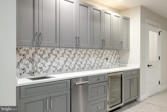 a living room with furniture a window and gym equipment