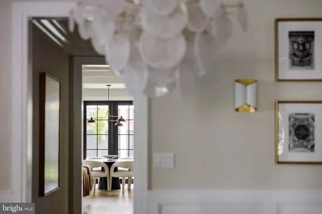 a view of hallway with livingroom and furniture