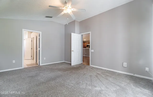 a bathroom with a double vanity sink mirror and shower