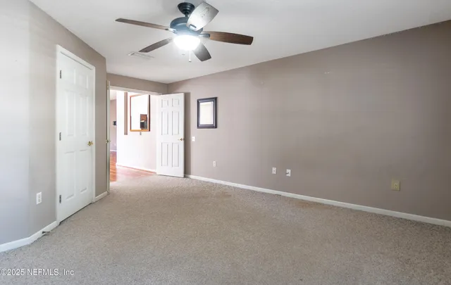 a bathroom with a sink toilet vanity and tub