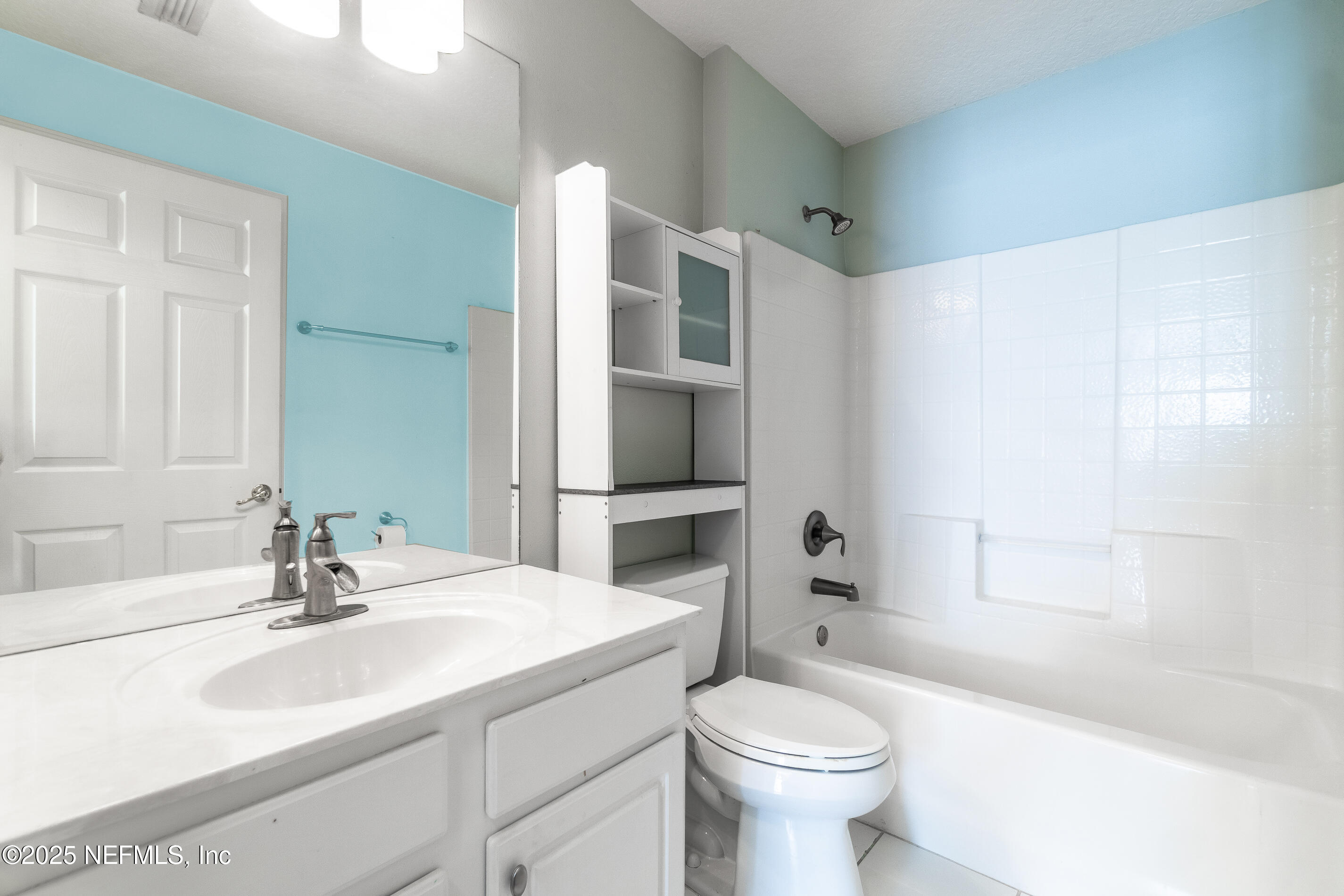 1325 Fairway Village Drive Fleming Island, FL 32003 - Photo 18 of 36 a bathroom with a sink toilet vanity and tub