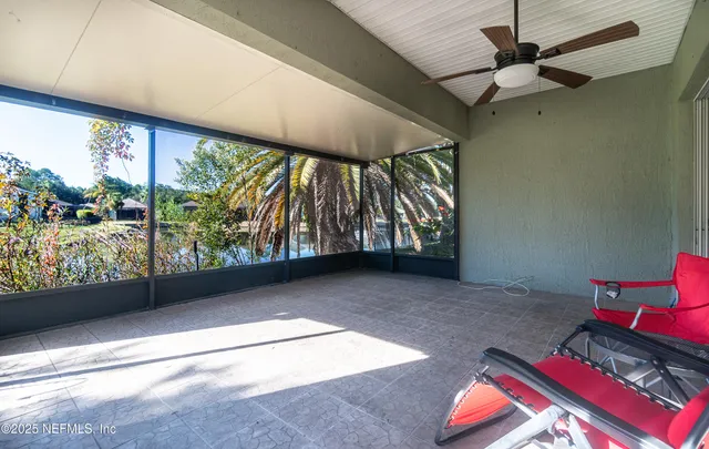a view of a porch with furniture and front door