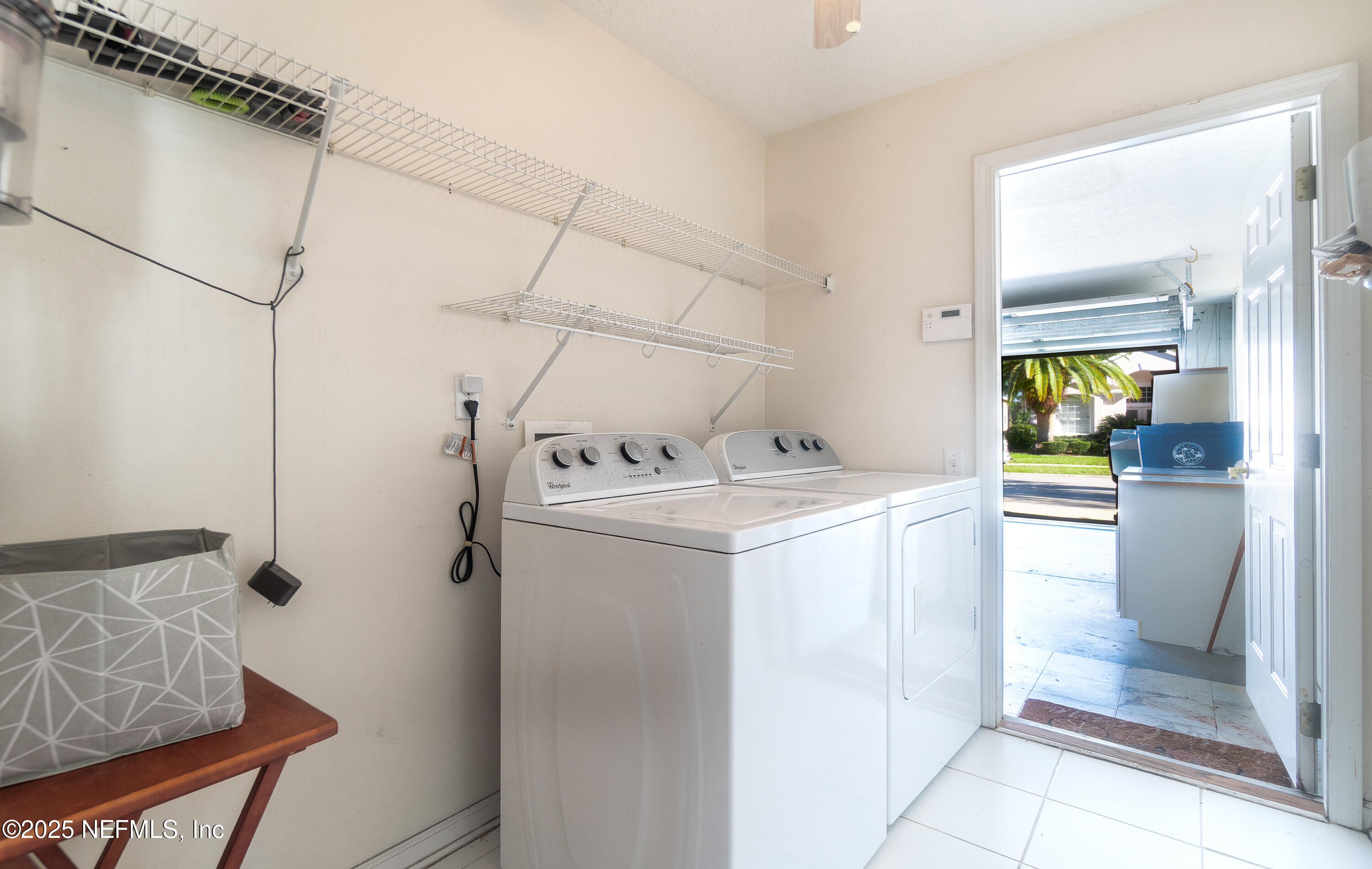 1325 Fairway Village Drive Fleming Island, FL 32003 - Photo 23 of 36 a utility room with washer and dryer