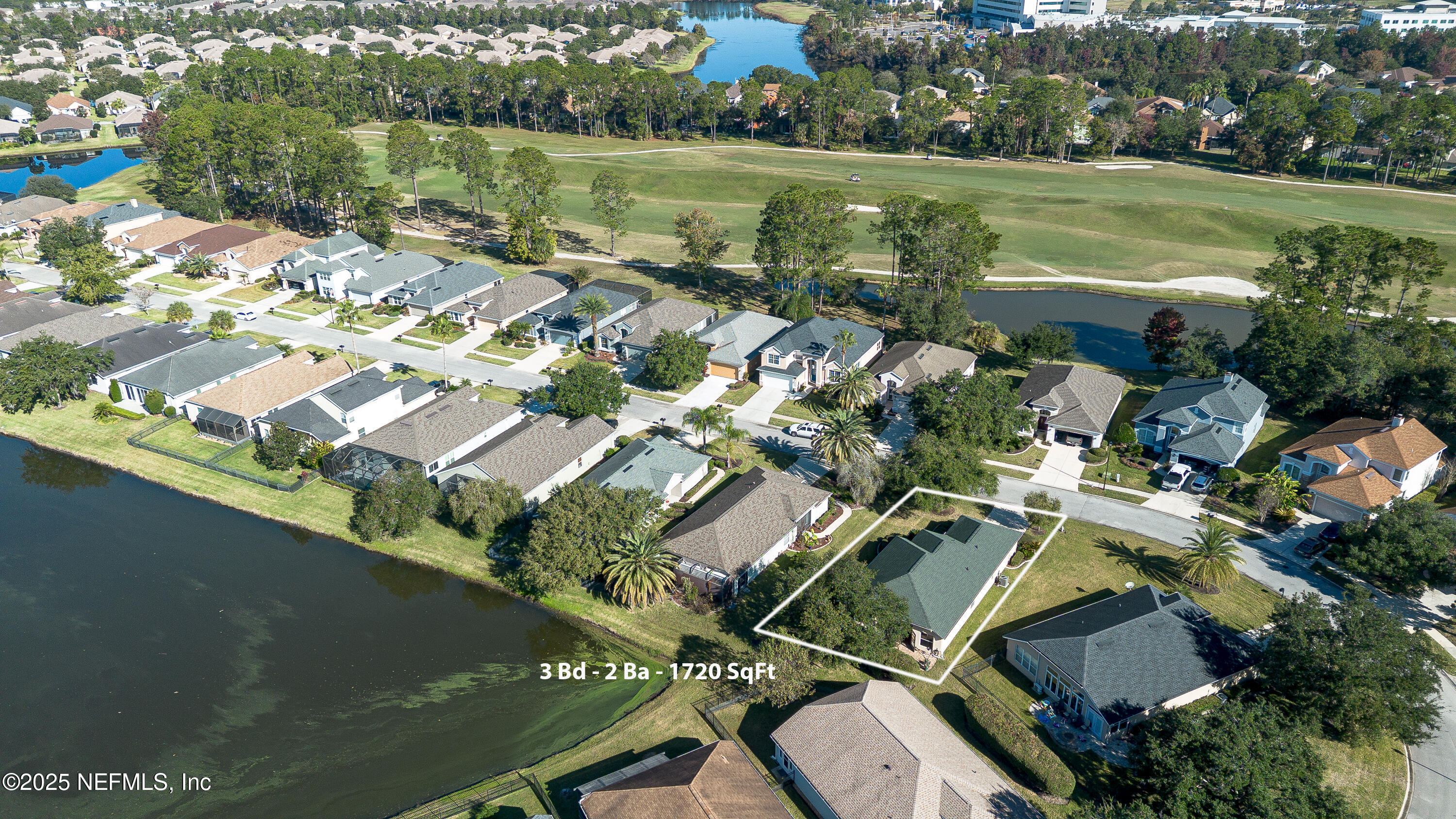 1325 Fairway Village Drive Fleming Island, FL 32003 - Photo 26 of 36 an aerial view of residential houses with outdoor space and lake view