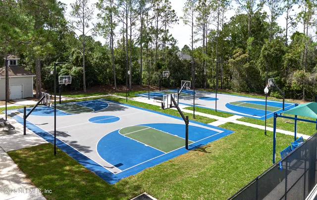 a view of a backyard with furniture and a table