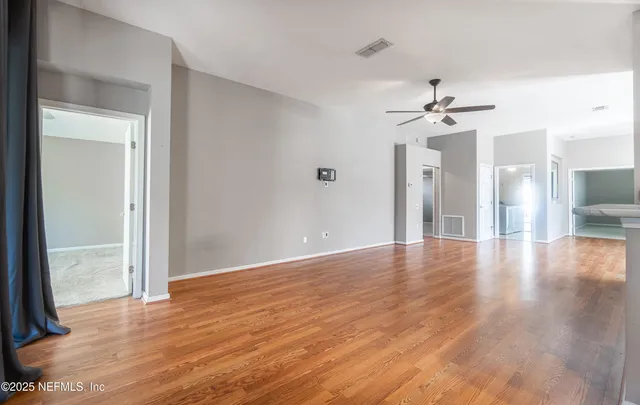 a view of kitchen with cabinets and wooden floor