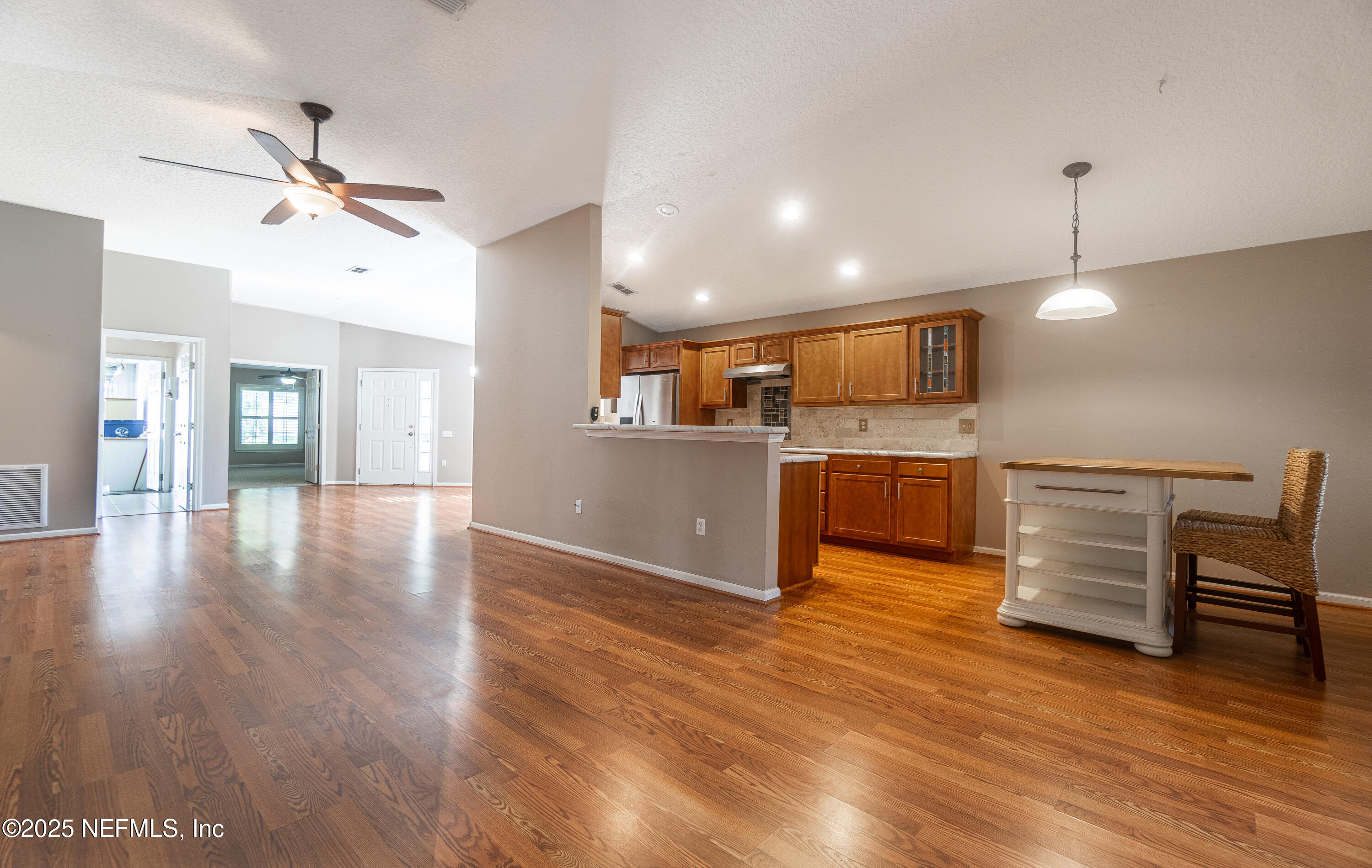 1325 Fairway Village Drive Fleming Island, FL 32003 - Photo 8 of 36 a view of kitchen with cabinets and wooden floor