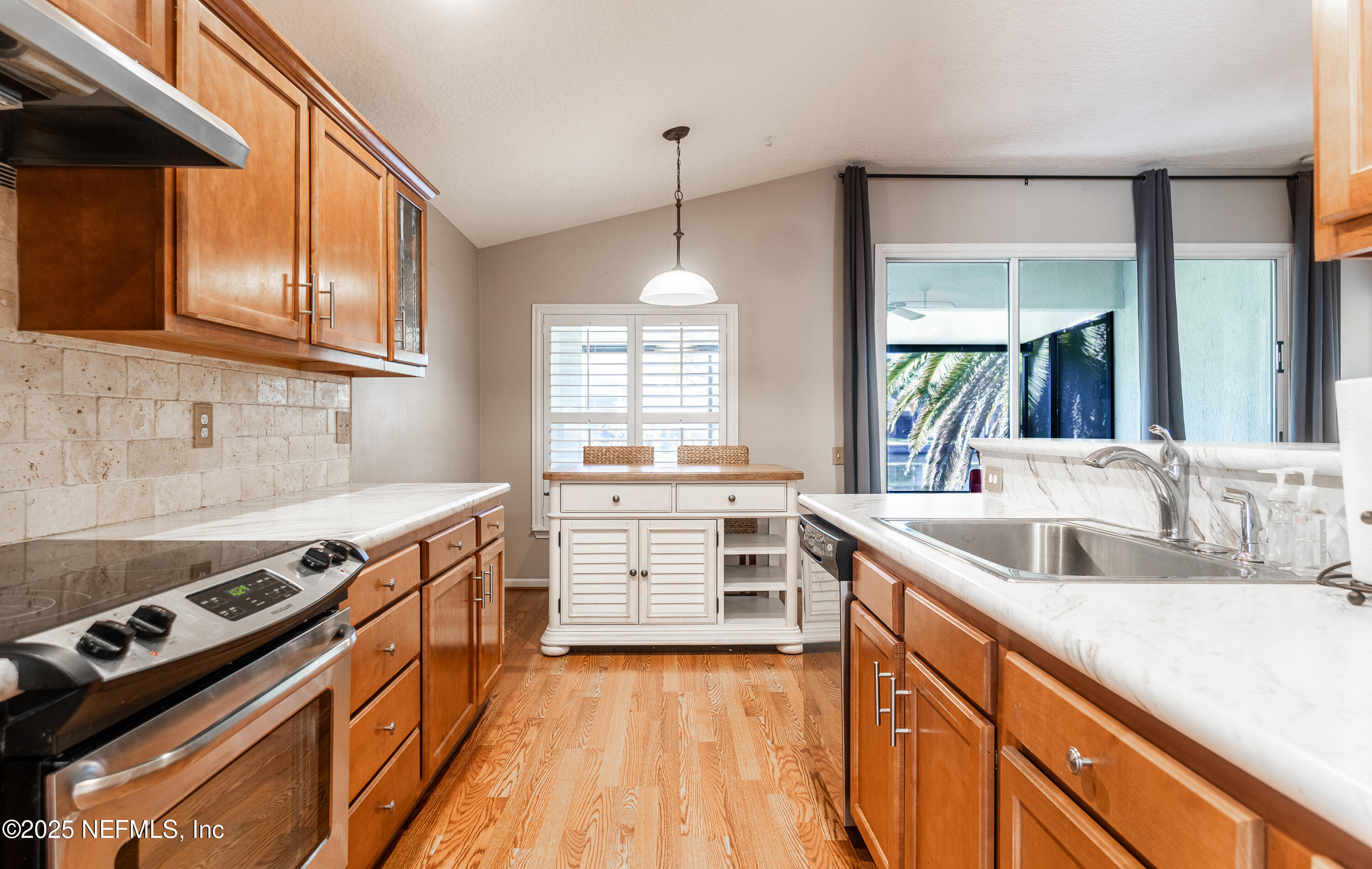 1325 Fairway Village Drive Fleming Island, FL 32003 - Photo 9 of 36 a kitchen with a stove and a sink