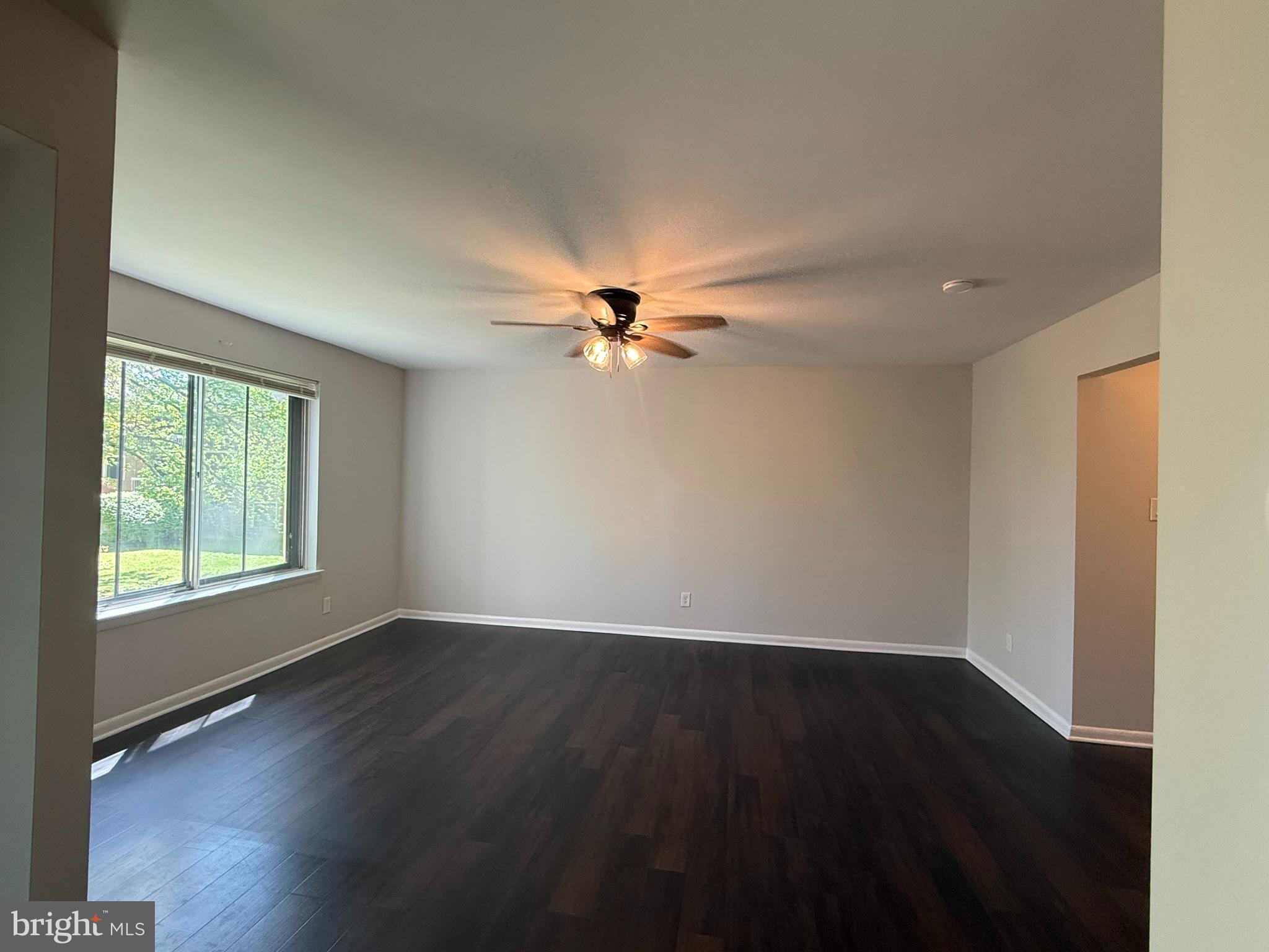123 Echelon Road Voorhees, NJ 08043 - Photo 11 of 23 an empty room with wooden floor fan and windows