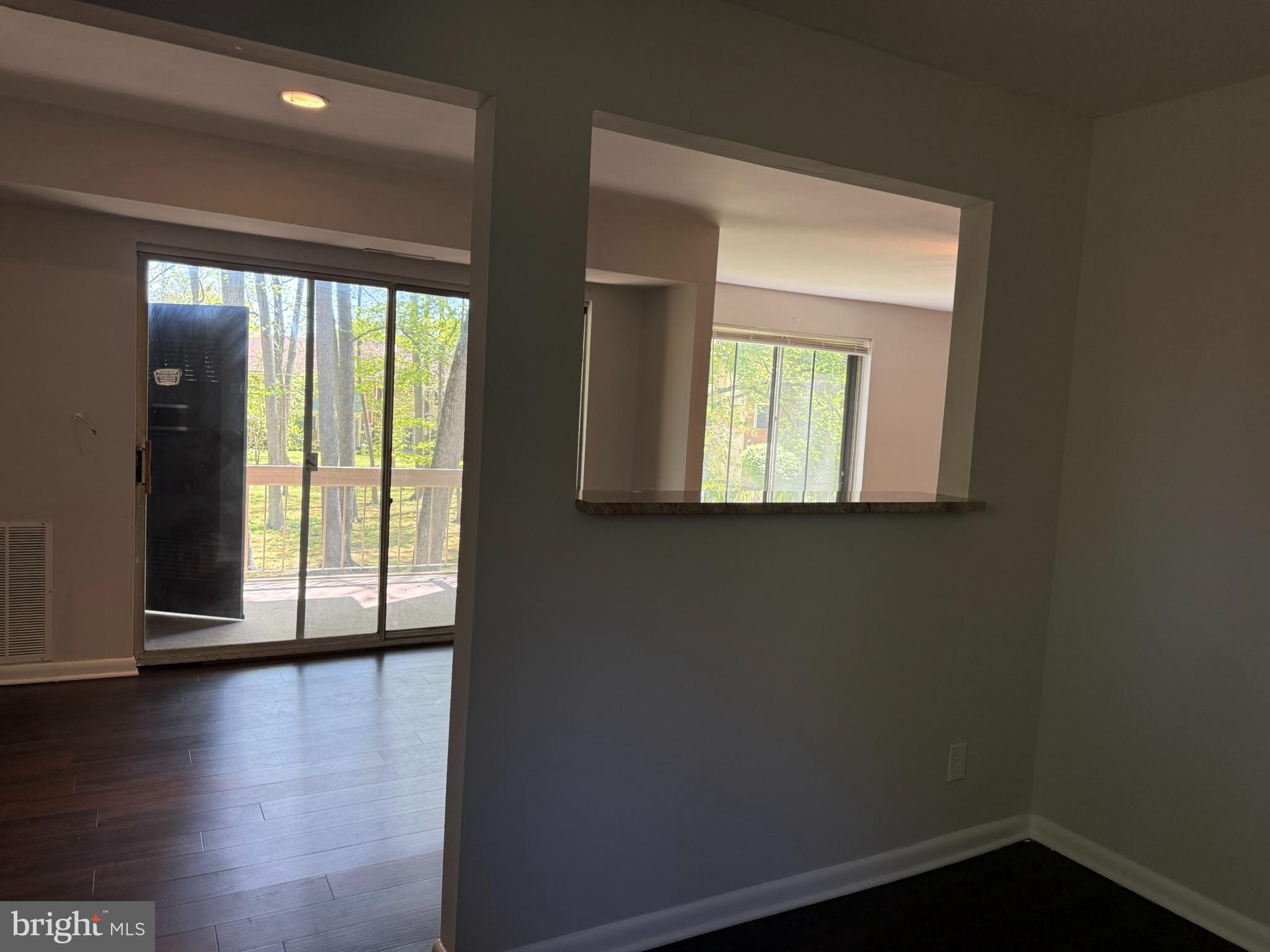 123 Echelon Road Voorhees, NJ 08043 - Photo 6 of 23 an empty room with wooden floor and a window
