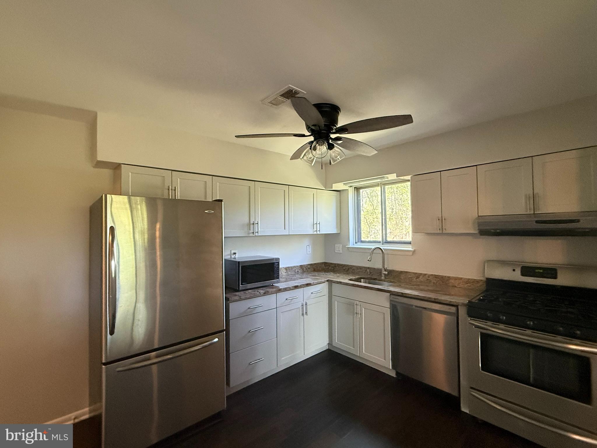 123 Echelon Road Voorhees, NJ 08043 - Photo 7 of 23 a kitchen with stainless steel appliances a refrigerator sink and microwave
