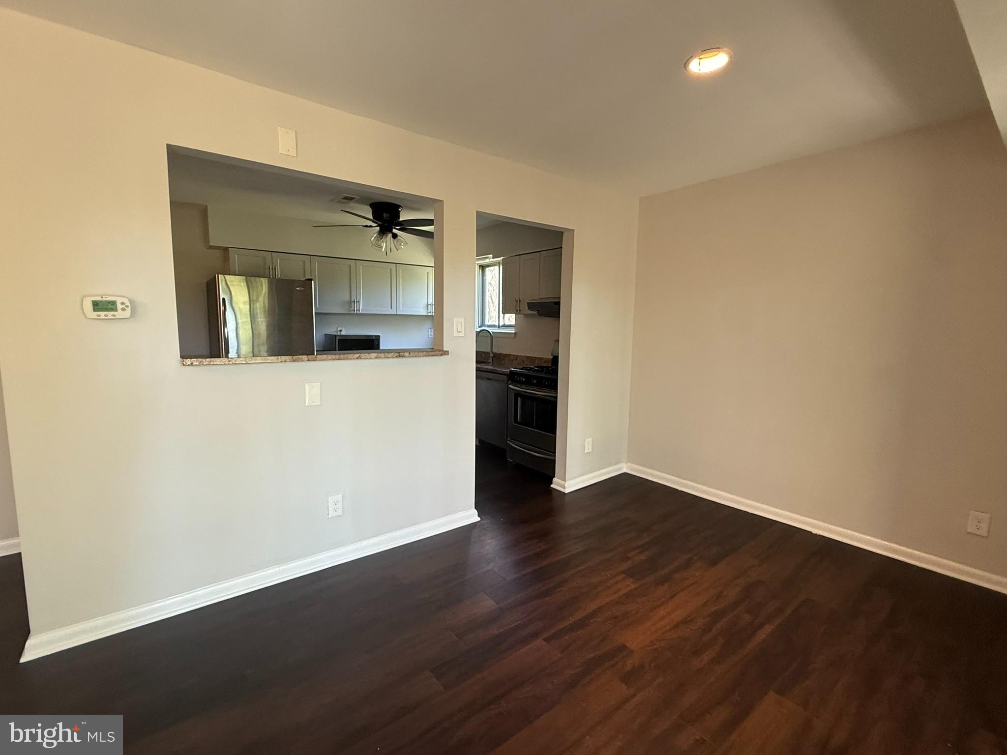 123 Echelon Road Voorhees, NJ 08043 - Photo 9 of 23 an empty room with wooden floor and cabinet