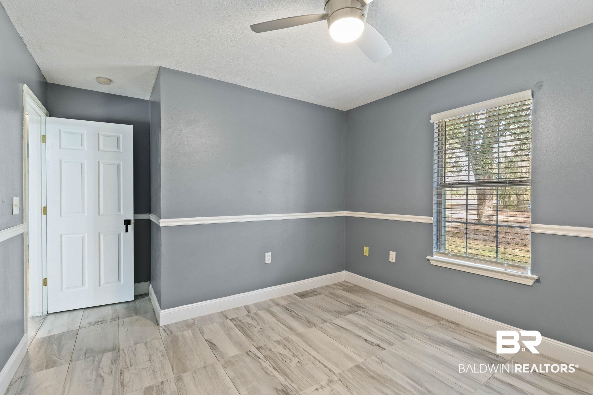 17366 Old Brady Road Bay Minette, AL 36507 - Photo 22 of 43 Empty room featuring baseboards and ceiling fan