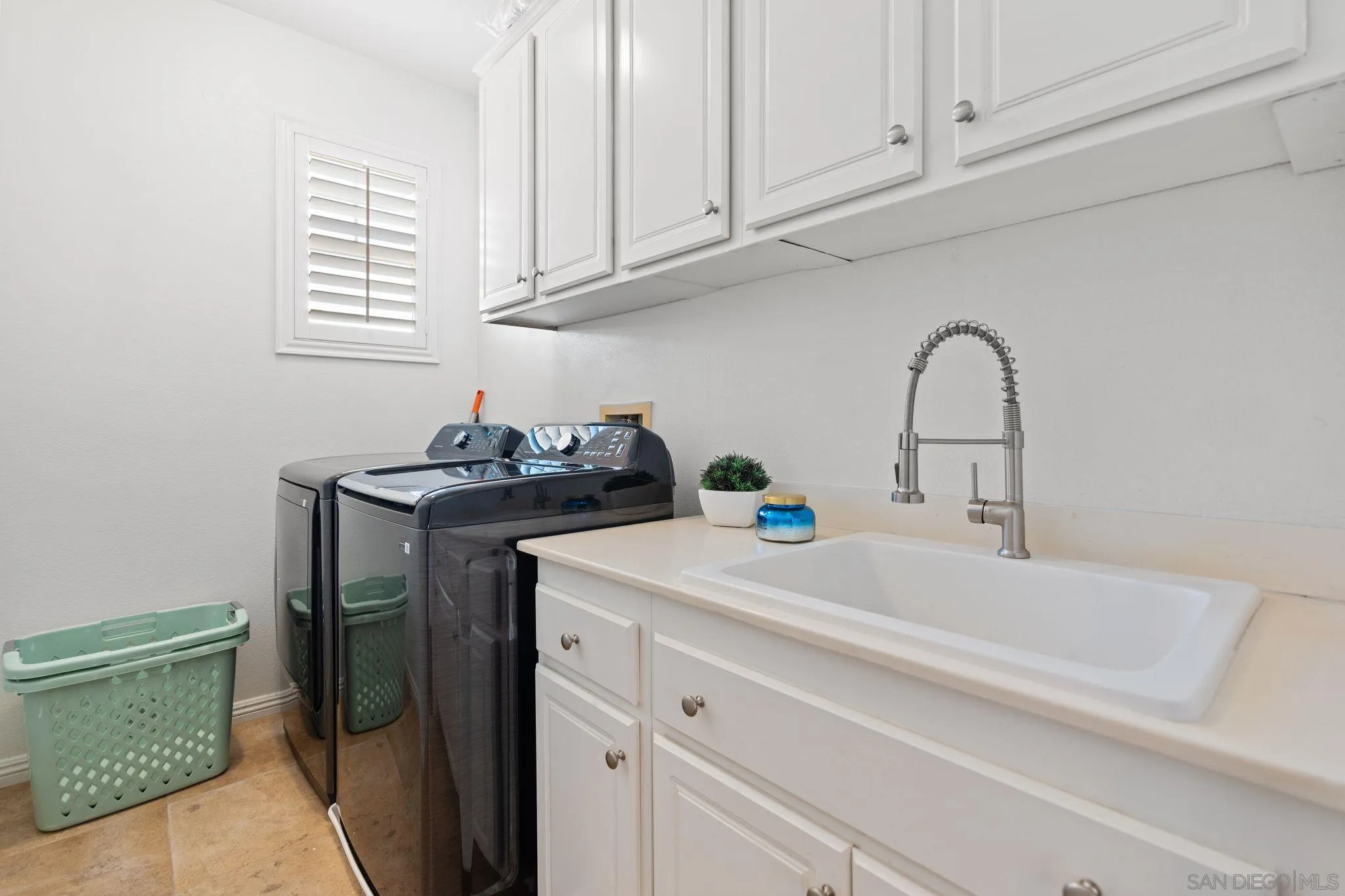 2887 Corte Morera Carlsbad, CA 92009 - Photo 49 of 68 a bathroom with a sink and a window