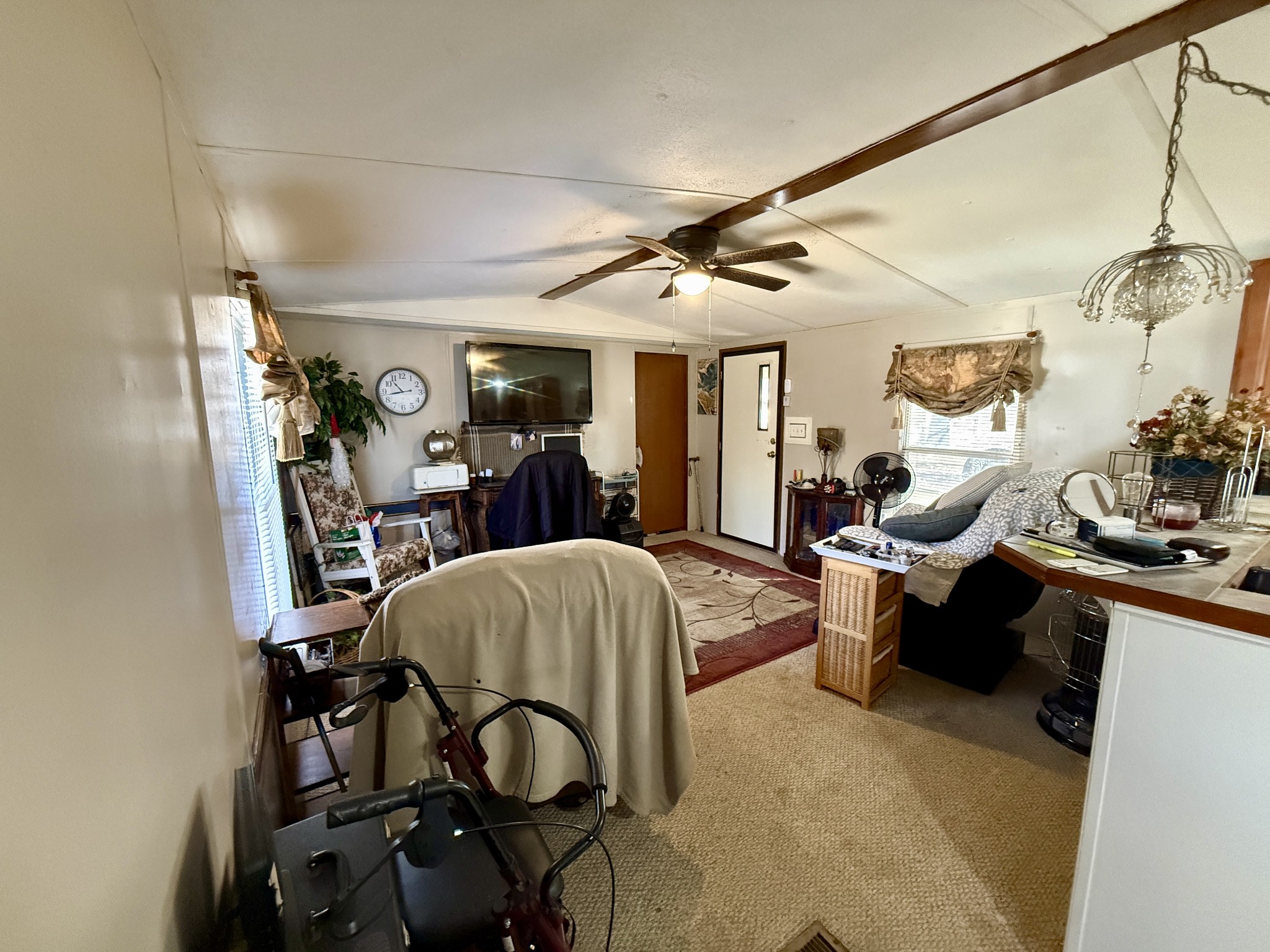 299 Sunset Drive Holladay, TN 38341 - Photo 11 of 27 a living room with furniture a dining table and chairs with the view of kitchen