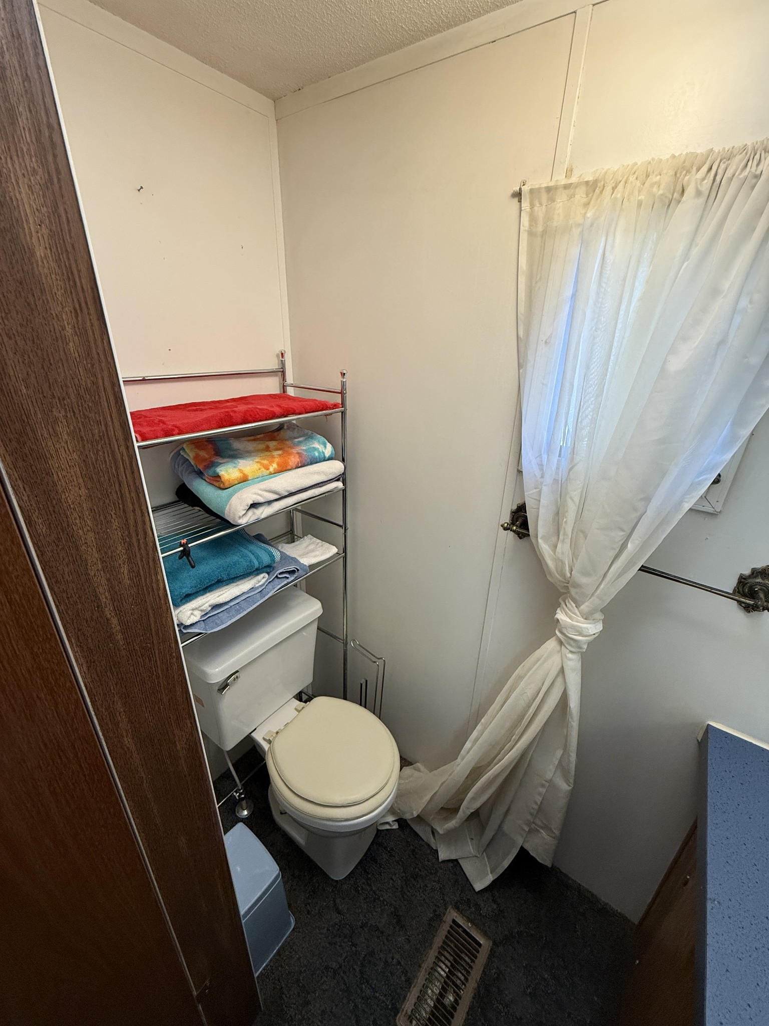 299 Sunset Drive Holladay, TN 38341 - Photo 15 of 27 a bathroom with a toilet and a shower