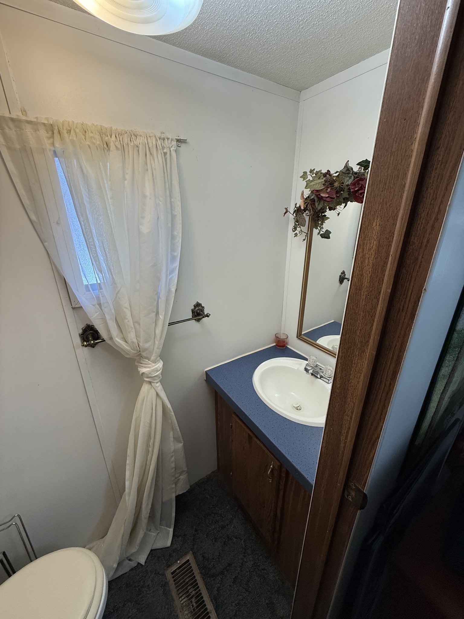 299 Sunset Drive Holladay, TN 38341 - Photo 16 of 27 a bathroom with a sink toilet and shower