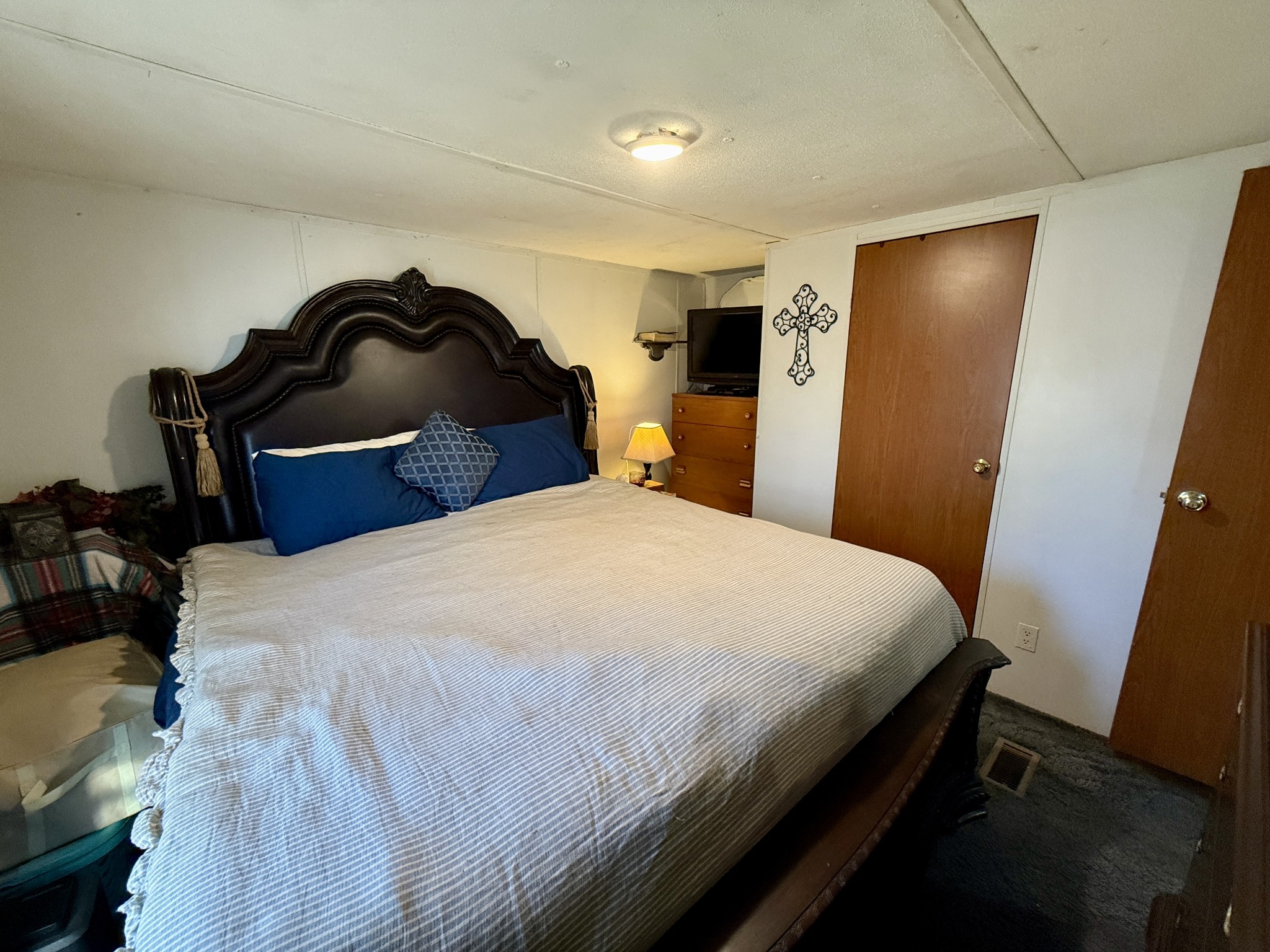 299 Sunset Drive Holladay, TN 38341 - Photo 18 of 27 a bedroom with a bed and a painting on the wall