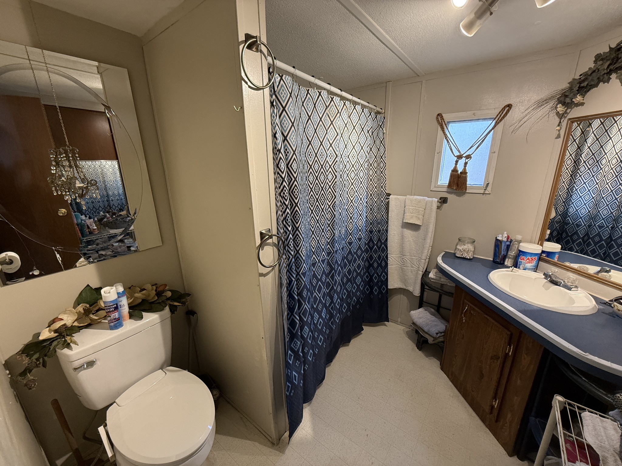 299 Sunset Drive Holladay, TN 38341 - Photo 19 of 27 a bathroom with a sink toilet and shower