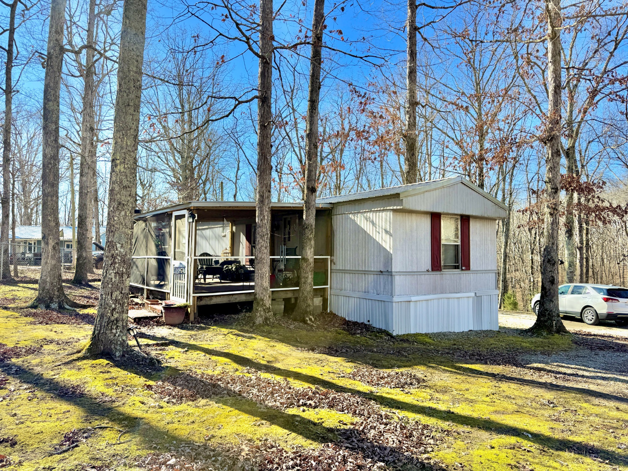 299 Sunset Drive Holladay, TN 38341 - Photo 21 of 27 a view of a house with a swimming pool