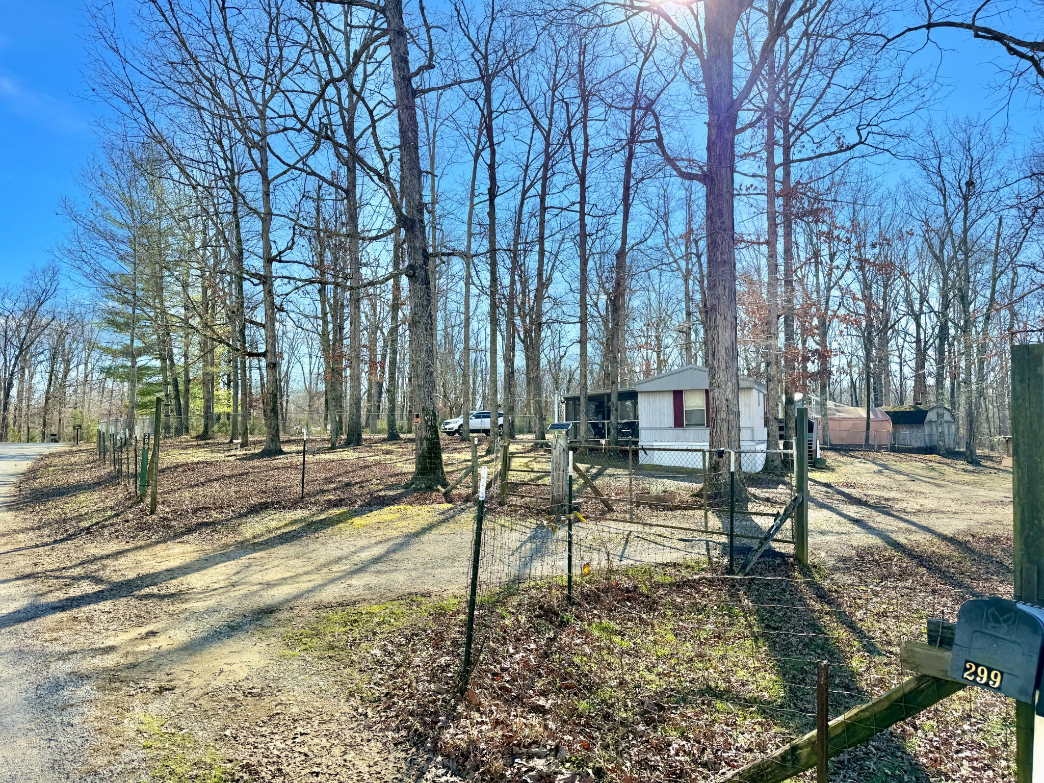 299 Sunset Drive Holladay, TN 38341 - Photo 27 of 27 a view of a bench in a backyard of a house