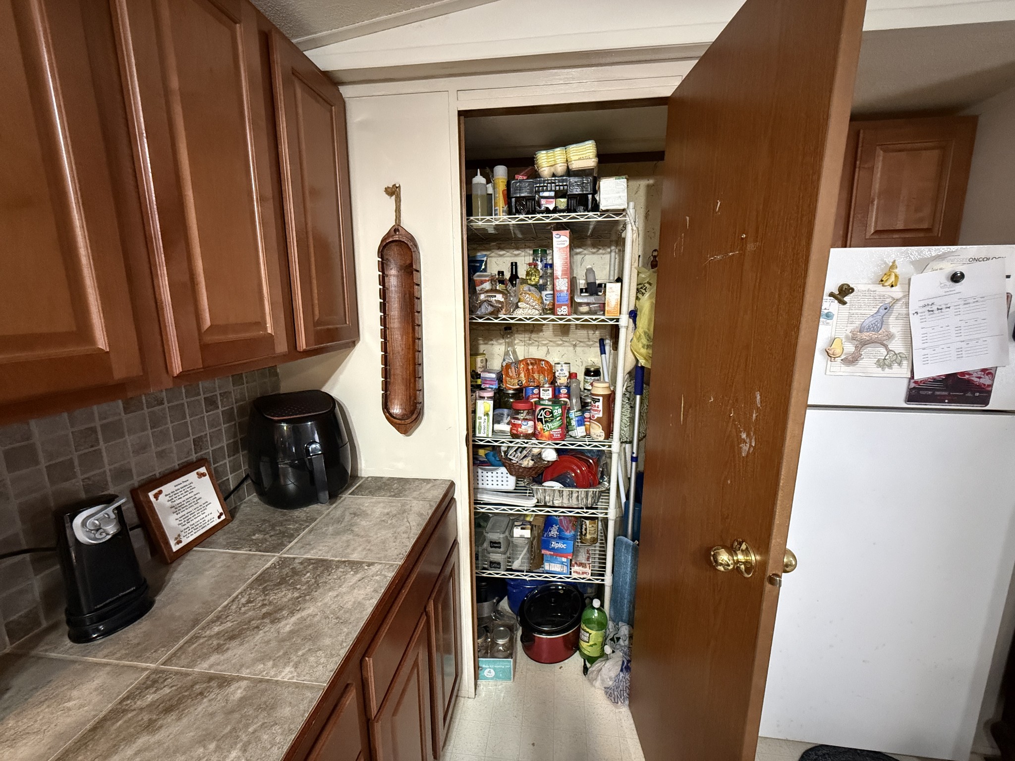 299 Sunset Drive Holladay, TN 38341 - Photo 8 of 27 a kitchen with stainless steel appliances granite countertop a refrigerator and a stove