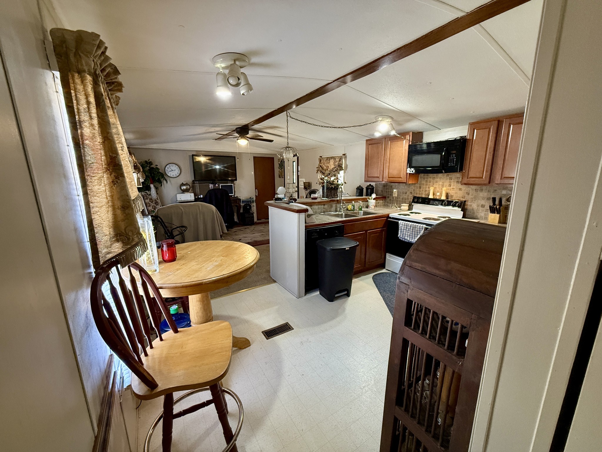 299 Sunset Drive Holladay, TN 38341 - Photo 9 of 27 a view of a dining room with furniture window and wooden floor