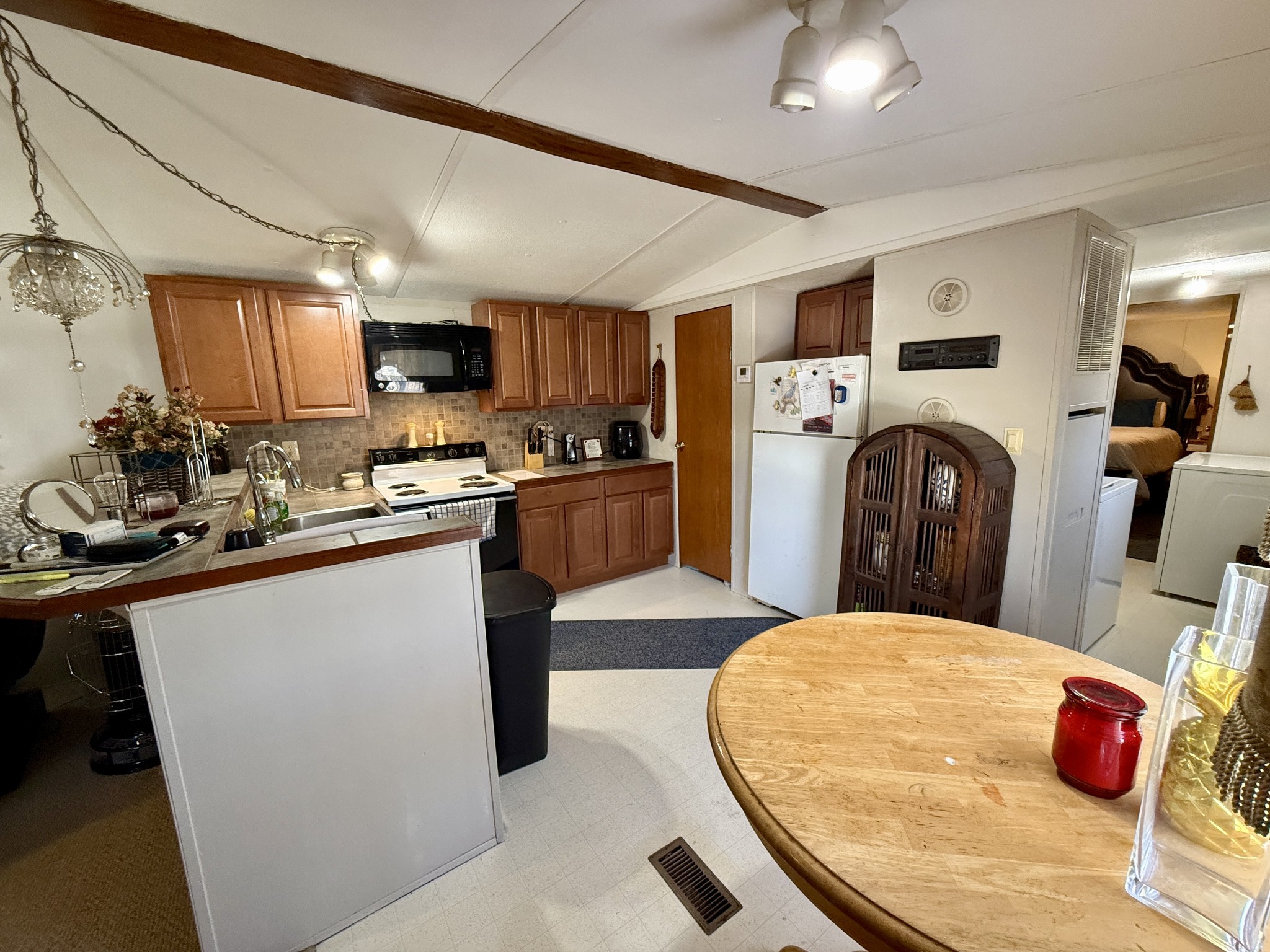 299 Sunset Drive Holladay, TN 38341 - Photo 10 of 27 a kitchen with a sink appliances and cabinets