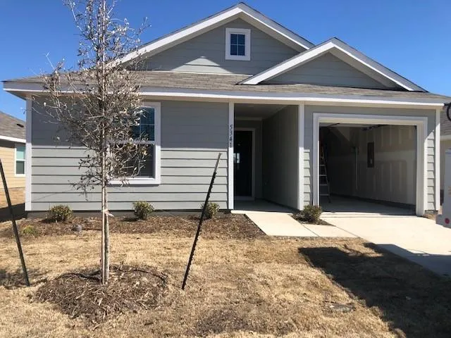 a front view of a house with a garage