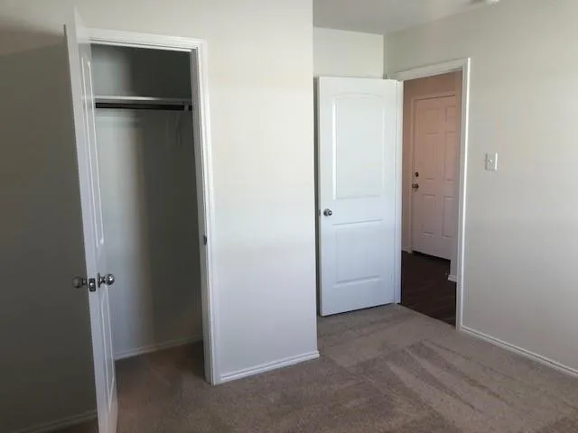 a bathroom with a granite countertop toilet a sink and bathtub