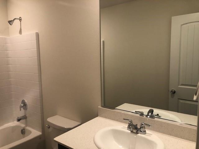 Undisclosed Address Princeton, TX 75407 - Photo 12 of 23 a bathroom with a sink a toilet and shower