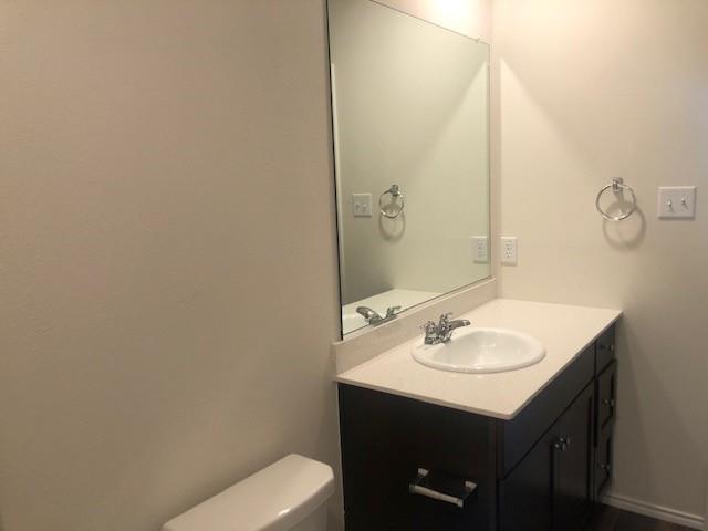 Undisclosed Address Princeton, TX 75407 - Photo 15 of 23 a bathroom with a sink toilet and vanity