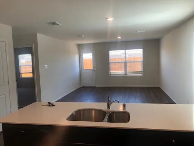 a kitchen with a sink and cabinets