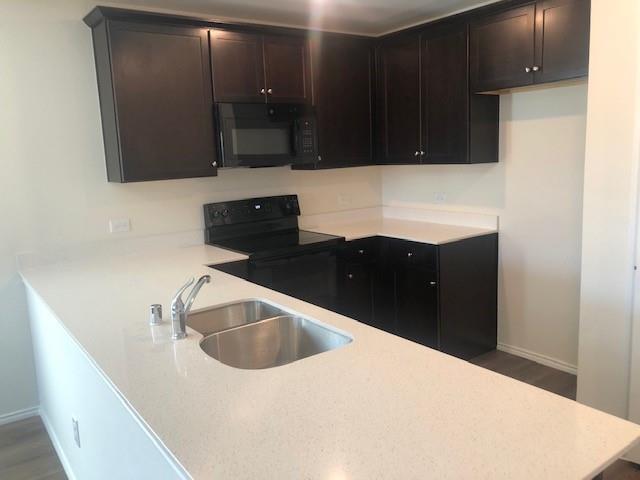 Undisclosed Address Princeton, TX 75407 - Photo 19 of 23 a kitchen with a sink and cabinets