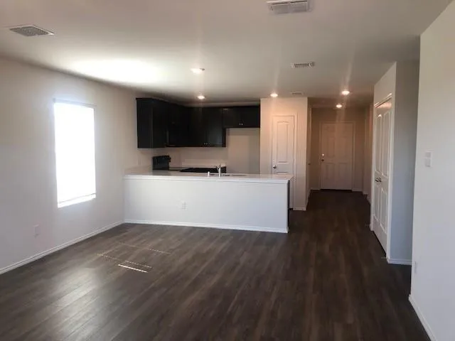 a view of a kitchen with a sink and a dishwasher