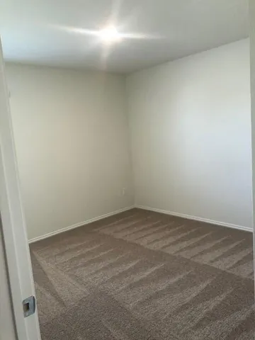 a view of a kitchen with microwave and cabinets