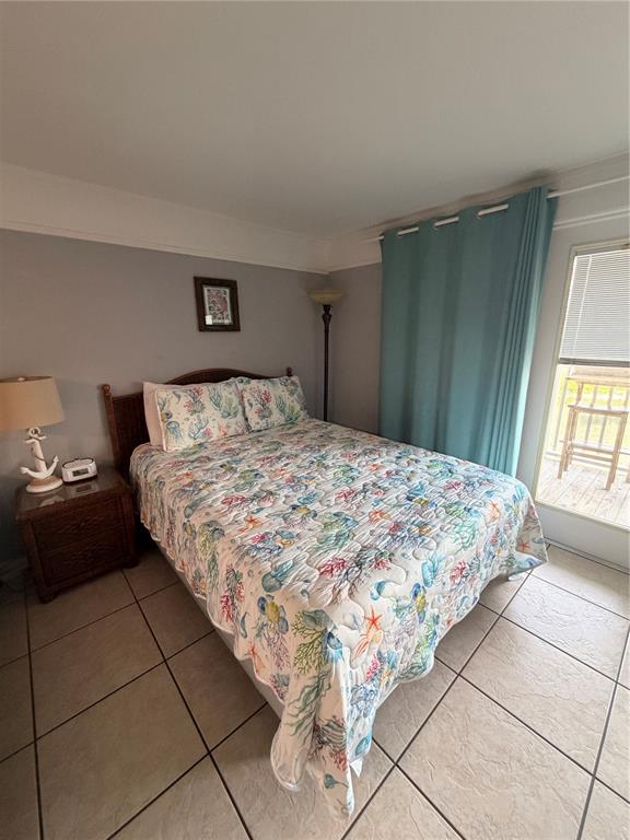82 2nd Street, Unit D5 Cedar Key, FL 32625 - Photo 10 of 31 a bedroom with a bed and a window