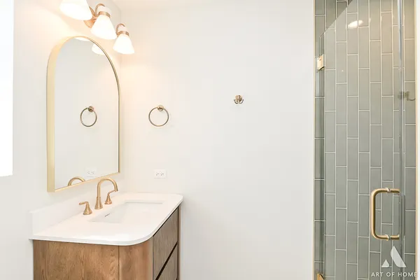 a bathroom with a sink and mirror