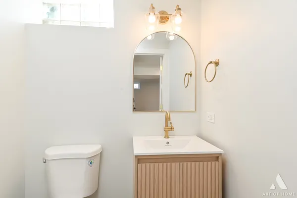 a bathroom with a sink and mirror