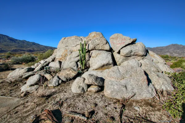 a view of outdoor space with a mountain in the background
