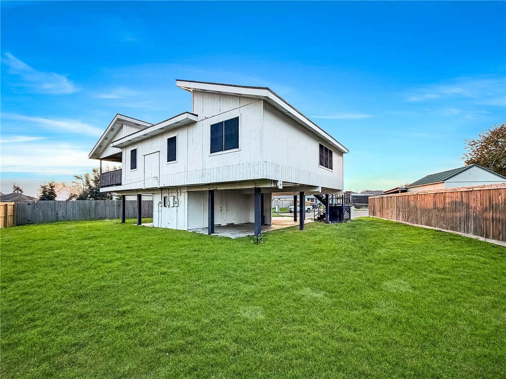 302 Easy Street, Unit B Corpus Christi, TX 78418 - Photo 24 of 27 a view of a house with a yard and sitting area