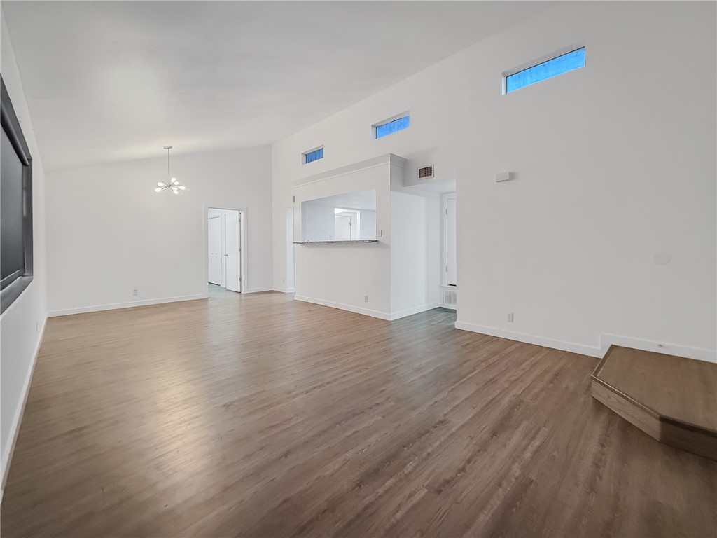 302 Easy Street, Unit B Corpus Christi, TX 78418 - Photo 5 of 27 a view of empty room with wooden floor and fan